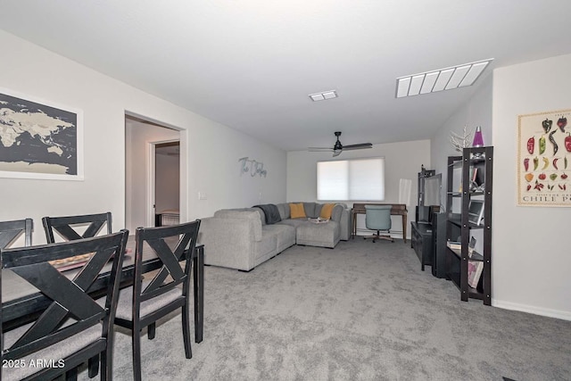 living room featuring light colored carpet and ceiling fan