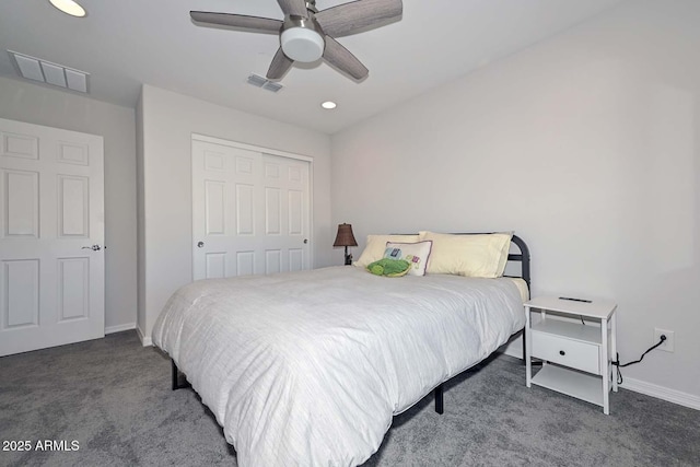 carpeted bedroom featuring a closet and ceiling fan