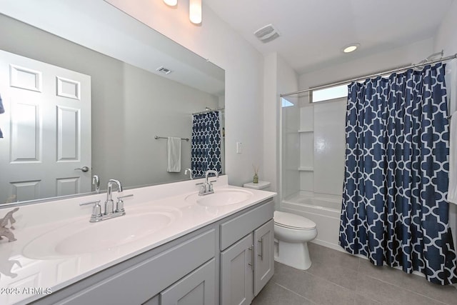 full bathroom featuring tile patterned flooring, vanity, toilet, and shower / bathtub combination with curtain