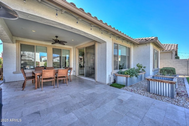 view of patio featuring ceiling fan