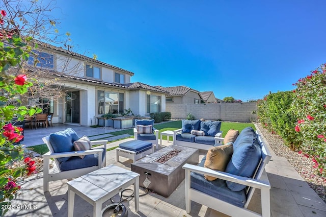 view of patio / terrace with an outdoor living space with a fire pit