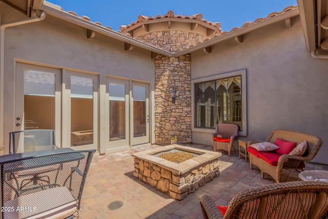 view of patio / terrace with a fire pit