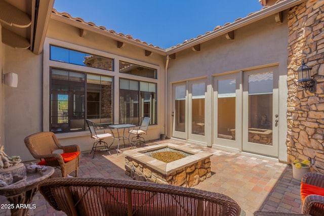 view of patio / terrace with a fire pit