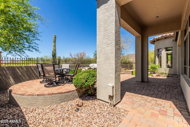view of patio / terrace with a fenced backyard and outdoor dining space