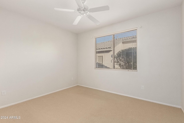 carpeted empty room with ceiling fan