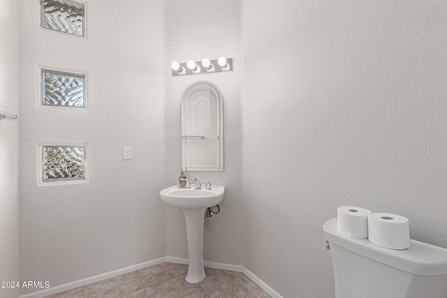 bathroom with tile patterned floors and toilet