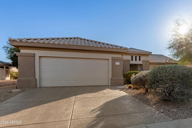 view of front of home with a garage