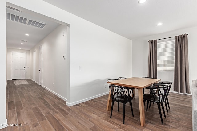 dining room with dark hardwood / wood-style flooring