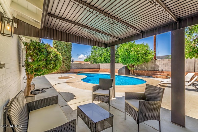 view of swimming pool featuring a fenced backyard, a patio area, and outdoor lounge area