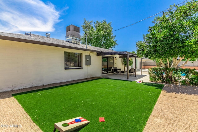 fenced backyard with a patio area