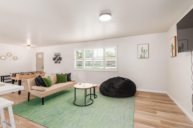 living room featuring light wood-style floors and baseboards