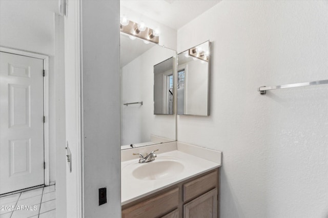 bathroom with vanity and tile patterned flooring