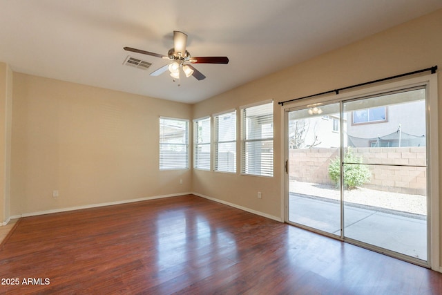 4010 W Fremont Rd, Phoenix, AZ 85041 - spare room with ceiling fan, healthy amount of natural light, and wood finished floors
