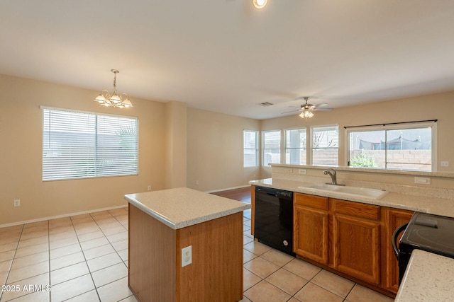 4010 W Fremont Rd, Phoenix, AZ 85041 - kitchen with black appliances, a sink, light tile patterned flooring, and healthy amount of natural light