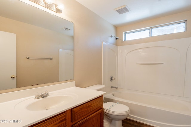 4010 W Fremont Rd, Phoenix, AZ 85041 - bathroom with toilet, vanity, tub / shower combination, and wood finished floors
