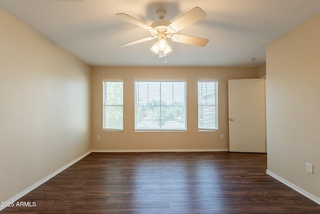 4010 W Fremont Rd, Phoenix, AZ 85041 - spare room with dark wood finished floors, a ceiling fan, and baseboards
