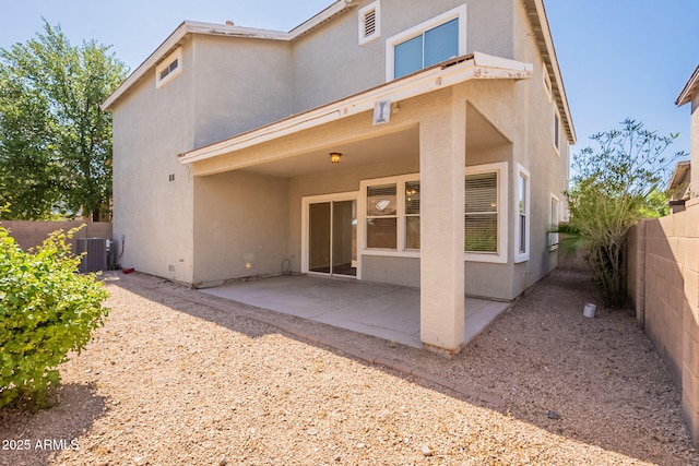 4010 W Fremont Rd, Phoenix, AZ 85041 - back of house featuring stucco siding, central air condition unit, a fenced backyard, and a patio