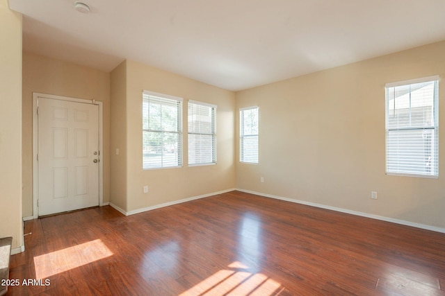 4010 W Fremont Rd, Phoenix, AZ 85041 - spare room featuring plenty of natural light, wood finished floors, baseboards, and a smoke detector