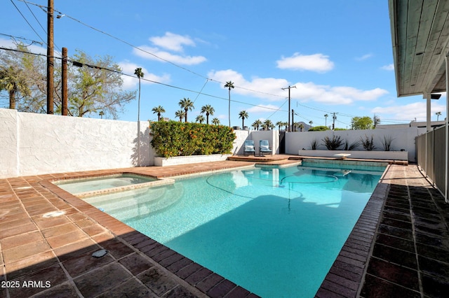 view of swimming pool featuring a fenced backyard, a diving board, a fenced in pool, an in ground hot tub, and a patio area