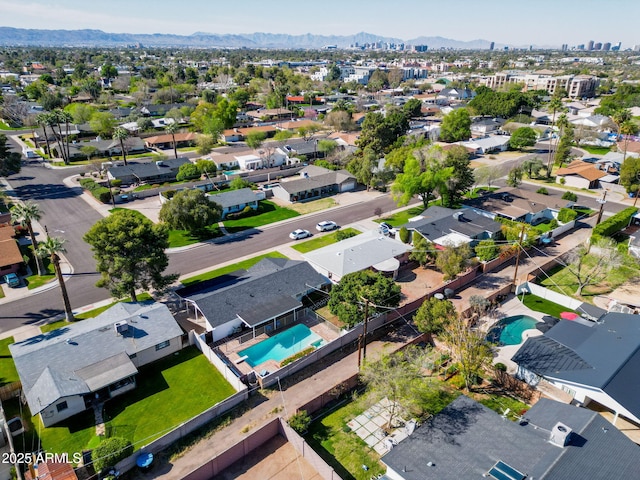 birds eye view of property featuring a mountain view and a residential view