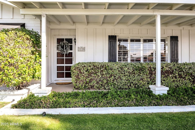 property entrance with board and batten siding