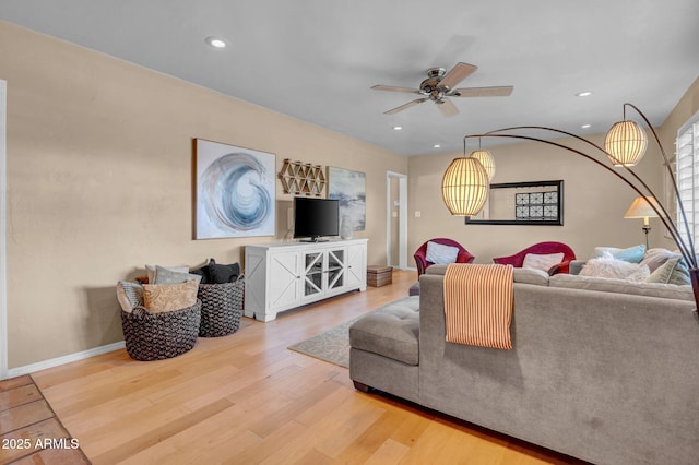 living area with ceiling fan, baseboards, wood finished floors, and recessed lighting