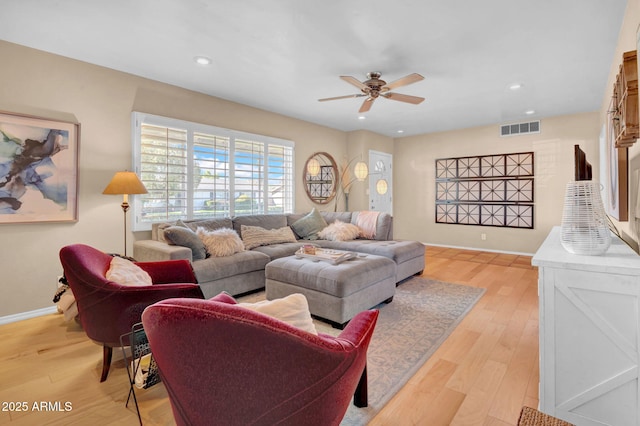 living room with visible vents, baseboards, ceiling fan, recessed lighting, and light wood-style flooring