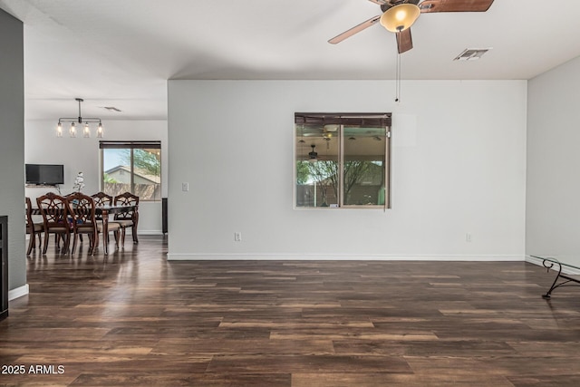 7090 S 252nd Dr, Buckeye, AZ 85326 - spare room with a ceiling fan, wood finished floors, a chandelier, and baseboards