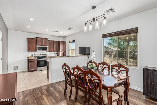 7090 S 252nd Dr, Buckeye, AZ 85326 - dining space with recessed lighting, baseboards, and light wood finished floors