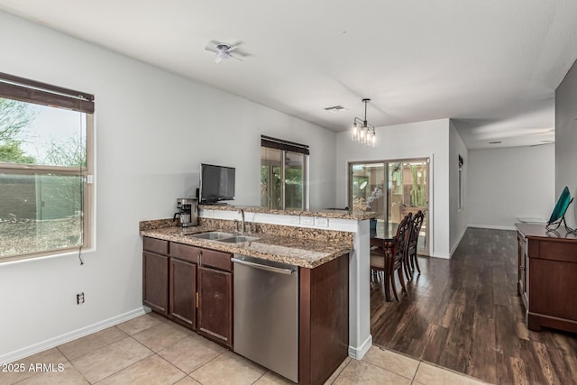 7090 S 252nd Dr, Buckeye, AZ 85326 - kitchen with stainless steel dishwasher, a sink, and plenty of natural light