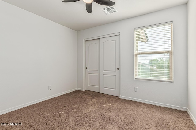 7090 S 252nd Dr, Buckeye, AZ 85326 - unfurnished bedroom featuring carpet flooring, multiple windows, and a closet
