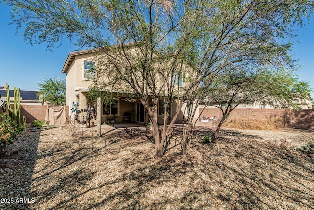 7090 S 252nd Dr, Buckeye, AZ 85326 - rear view of house featuring a fenced backyard, a patio area, and stucco siding