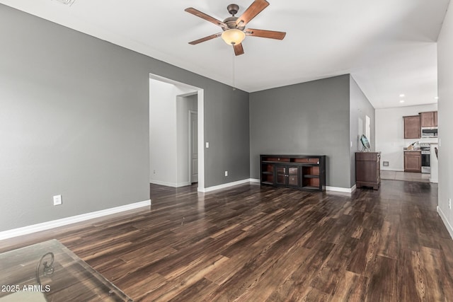 7090 S 252nd Dr, Buckeye, AZ 85326 - unfurnished living room with ceiling fan, dark wood-style flooring, and baseboards