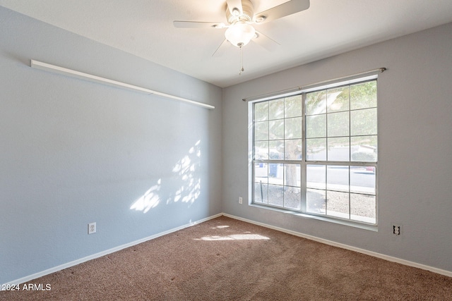 carpeted empty room with ceiling fan