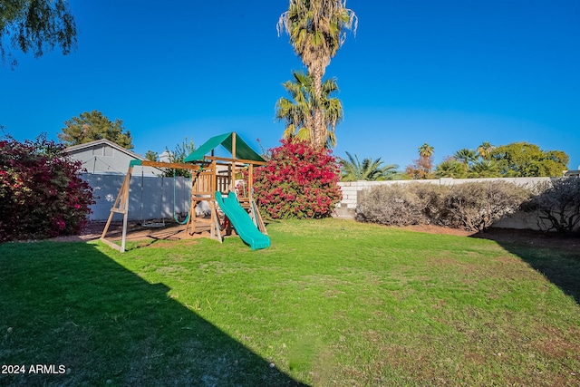 view of playground with a yard