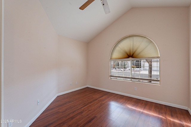 spare room with ceiling fan, lofted ceiling, and dark hardwood / wood-style flooring