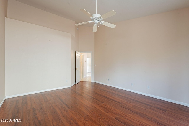 unfurnished room featuring ceiling fan and dark hardwood / wood-style flooring