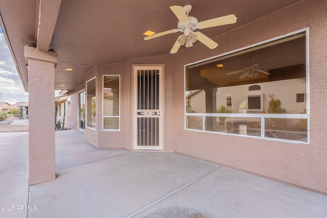 view of patio with ceiling fan