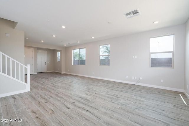 1571 E Tiffany Way, Gilbert, AZ 85298 - unfurnished room featuring stairs, light wood finished floors, baseboards, and recessed lighting