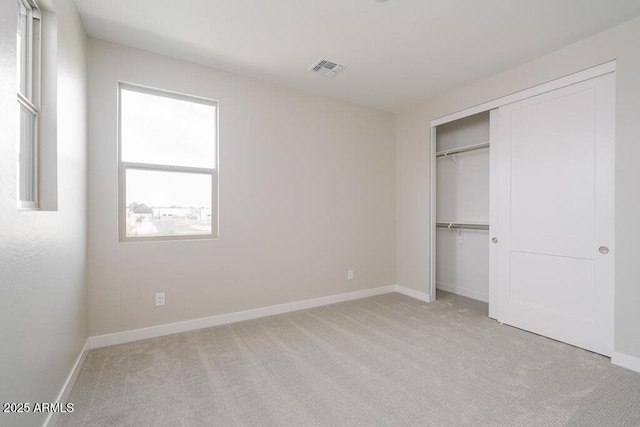 1571 E Tiffany Way, Gilbert, AZ 85298 - unfurnished bedroom with light carpet, baseboards, and a closet
