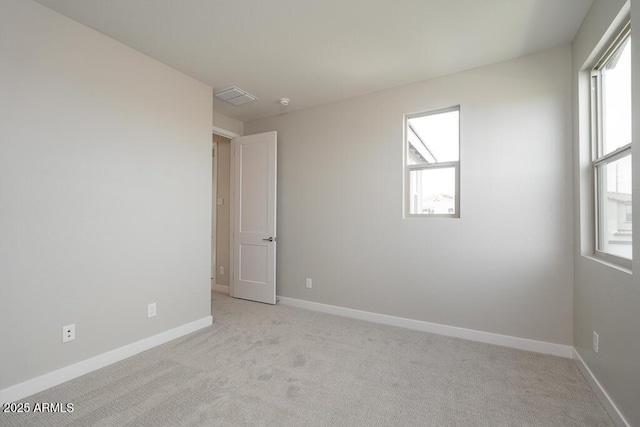 1571 E Tiffany Way, Gilbert, AZ 85298 - empty room with healthy amount of natural light, light colored carpet, and baseboards
