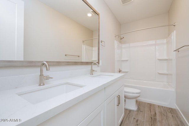 1571 E Tiffany Way, Gilbert, AZ 85298 - bathroom with double vanity, toilet, bathtub / shower combination, and wood finished floors