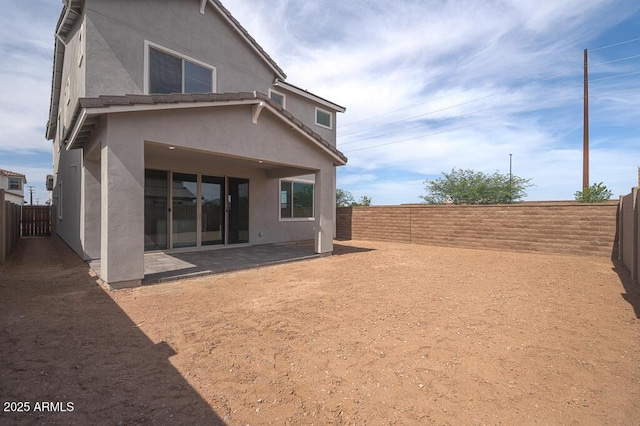 1571 E Tiffany Way, Gilbert, AZ 85298 - back of property featuring stucco siding, a patio area, and a fenced backyard