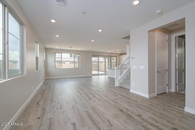 1571 E Tiffany Way, Gilbert, AZ 85298 - spare room featuring light wood-style floors, stairs, recessed lighting, and baseboards