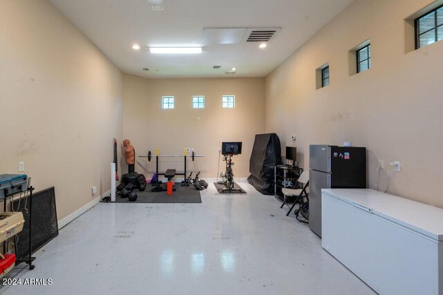 recreation room featuring light tile patterned flooring, pool table, and a towering ceiling