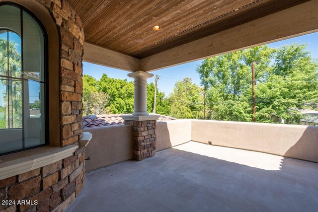 unfurnished dining area featuring a notable chandelier, a healthy amount of sunlight, and light tile patterned floors