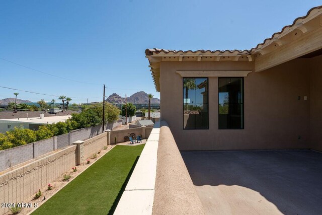 tiled dining space featuring plenty of natural light, a notable chandelier, and a mountain view