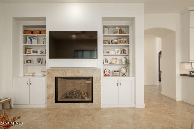 garage featuring stainless steel refrigerator and fridge