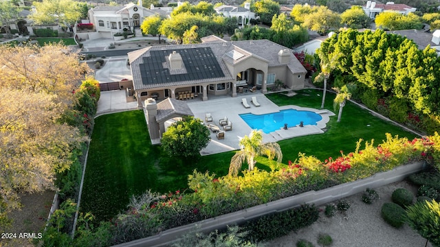 view of pool featuring a yard and a patio area