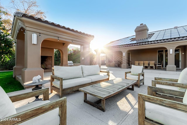 view of patio / terrace featuring an outdoor living space with a fireplace